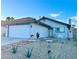 Charming single-story home with a two-car garage and desert landscaping at 7728 Barbican Ct, Las Vegas, NV 89147