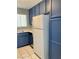 Functional kitchen includes a refrigerator, dishwasher, and ample cabinet space at 7728 Barbican Ct, Las Vegas, NV 89147