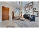 Inviting living room with lots of light and a piano at 7778 Villa Montara St, Las Vegas, NV 89123