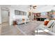 Open-concept living space with hardwood floors, neutral paint, and seamless flow to the kitchen at 7778 Villa Montara St, Las Vegas, NV 89123