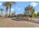 Attractive community entrance featuring a decorative sign and manicured landscaping at 7778 Villa Montara St, Las Vegas, NV 89123