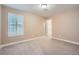 Empty bedroom with neutral walls, carpet, plantation shutters, and overhead light at 823 Safflower Ct, Henderson, NV 89015