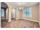 Bright dining room featuring modern lighting and wood floors at 823 Safflower Ct, Henderson, NV 89015