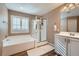 Main bathroom features a tub, separate shower, and a large vanity at 823 Safflower Ct, Henderson, NV 89015