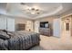 Main bedroom boasts tray ceiling, ceiling fan, and neutral carpet at 823 Safflower Ct, Henderson, NV 89015