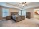 Main bedroom boasts neutral walls, tray ceiling, ceiling fan, and plantation shutters at 823 Safflower Ct, Henderson, NV 89015