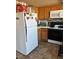 Well-lit kitchen featuring modern appliances, plenty of cabinet space, and tiled floors at 8408 W Gilmore Ave, Las Vegas, NV 89129