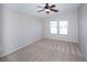 Spacious bedroom featuring neutral-toned walls, carpet, vaulted ceiling, and ample natural light from large windows at 8628 Tomnitz Ave # 101, Las Vegas, NV 89178