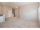 Bright living room boasts neutral carpet and light, airy paint; perfect for relaxation and entertaining at 8628 Tomnitz Ave # 101, Las Vegas, NV 89178