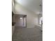 Bright living room featuring high ceilings, new carpet, and a window seat under a large window at 9325 W Desert Inn Rd # 233, Las Vegas, NV 89117
