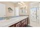 Bathroom featuring double sinks, decorative tile, and a glass-enclosed shower at 9517 Spanish Steps Ln, Las Vegas, NV 89117