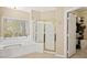 Bathroom with jacuzzi tub and shower at 9517 Spanish Steps Ln, Las Vegas, NV 89117