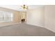 Large bedroom with natural light, plush carpeting, and views into the Primary bath at 9517 Spanish Steps Ln, Las Vegas, NV 89117