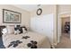 Bedroom featuring neutral colors, large closet, and a comfortable bed with decorative pillows at 9517 Spanish Steps Ln, Las Vegas, NV 89117