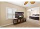 Relaxing bonus room with a mounted television, and bright natural light at 9517 Spanish Steps Ln, Las Vegas, NV 89117