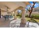 Inviting covered patio with multiple ceiling fans provides a comfortable outdoor seating area at 9517 Spanish Steps Ln, Las Vegas, NV 89117