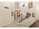Elegant foyer with a curved staircase, tile flooring, and soaring ceilings at 9517 Spanish Steps Ln, Las Vegas, NV 89117