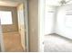 Bright bedroom featuring neutral carpet, ceiling fan, and large windows allowing ample natural light at 981 Leadville Meadows Dr, Henderson, NV 89052