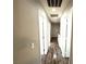 Hallway featuring hardwood floors and multiple doors at 981 Leadville Meadows Dr, Henderson, NV 89052