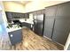 Well-lit kitchen featuring gray cabinetry, stainless steel appliances, and a functional center island at 981 Leadville Meadows Dr, Henderson, NV 89052