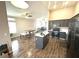 Open-concept kitchen with gray cabinets, stainless appliances, and an island at 981 Leadville Meadows Dr, Henderson, NV 89052