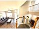 Spacious living room with hardwood floors, staircase, and natural light at 981 Leadville Meadows Dr, Henderson, NV 89052