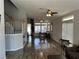 Open living area featuring wood floors, large windows for natural light, and staircase to the upper level at 981 Leadville Meadows Dr, Henderson, NV 89052