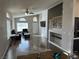 Living room featuring wood-look flooring, a ceiling fan, vaulted ceiling, and staircase at 981 Leadville Meadows Dr, Henderson, NV 89052