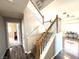 Inviting staircase with hardwood floors, carpeted steps, and bright lighting at 981 Leadville Meadows Dr, Henderson, NV 89052