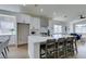 This eat-in kitchen features a large island with bar stool seating and stainless appliances at 10976 Salernes St, Las Vegas, NV 89141