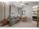 Bright bedroom with a ceiling fan and a view to an adjacent bathroom with updated vanity at 11322 Corsica Mist Ave, Las Vegas, NV 89135