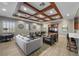 Relaxing resident common area featuring comfortable seating, media center, coffered ceilings and lots of natural light at 11322 Corsica Mist Ave, Las Vegas, NV 89135