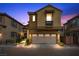 Charming two-story home featuring a stone pathway, two-car garage, and inviting curb appeal at 11322 Corsica Mist Ave, Las Vegas, NV 89135