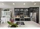 Modern kitchen with stainless steel appliances, quartz countertops, and custom cabinetry at 11322 Corsica Mist Ave, Las Vegas, NV 89135