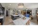 Open-concept living space with an island kitchen, dining and living room at 11322 Corsica Mist Ave, Las Vegas, NV 89135