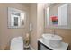 Stylish powder room with a modern vessel sink and decorative mirror at 11322 Corsica Mist Ave, Las Vegas, NV 89135