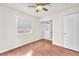 Bedroom with hardwood floors, a ceiling fan, a closet, and natural light from a window at 2151 Babylon Mill St, Henderson, NV 89002