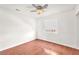 Bright bedroom with hardwood flooring, a ceiling fan, and a window for natural light at 2151 Babylon Mill St, Henderson, NV 89002