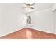 Bright bedroom with hardwood floors, ceiling fan and a view of the backyard at 2151 Babylon Mill St, Henderson, NV 89002