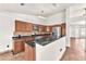 Kitchen with a large island, stainless steel appliances, wooden cabinets, and eat-in dining space at 2151 Babylon Mill St, Henderson, NV 89002