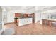 Spacious kitchen with a breakfast bar, stainless steel appliances, and tile flooring at 2151 Babylon Mill St, Henderson, NV 89002