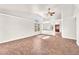 Bright and airy living room with tile flooring and a modern ceiling fan at 2151 Babylon Mill St, Henderson, NV 89002