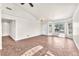 Sunlit living room with tile flooring, crown molding, and a bay window at 2151 Babylon Mill St, Henderson, NV 89002