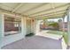Charming covered patio with brick flooring and access to lush backyard and outdoor living space at 2151 Babylon Mill St, Henderson, NV 89002