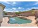 Backyard pool with a spa, a patio area, lush landscaping, and a privacy fence at 2151 Babylon Mill St, Henderson, NV 89002