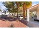 Spacious backyard area featuring mature trees and comfortable patio seating, perfect for relaxing and entertaining outdoors at 2246 Cassatt Dr, Henderson, NV 89074