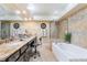 Bright bathroom with granite countertops, soaking tub, and tiled shower at 2246 Cassatt Dr, Henderson, NV 89074