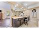 Well-lit bathroom featuring a granite countertop vanity with large mirror and tub shower at 2246 Cassatt Dr, Henderson, NV 89074