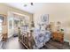 Cozy bedroom with a bay window for natural light and warm toned walls and floor at 2246 Cassatt Dr, Henderson, NV 89074