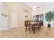 A spacious dining room offers tile floors, neutral paint colors and a ceiling fan at 2246 Cassatt Dr, Henderson, NV 89074
